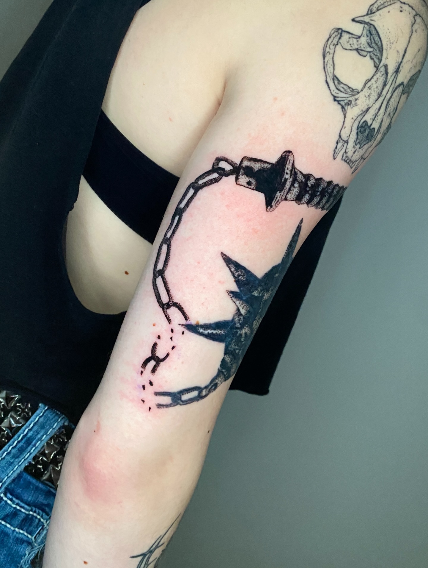 Barbed wire and chain black and grey tattoo on the forearm by Aidan Leery, Portland, Oregon