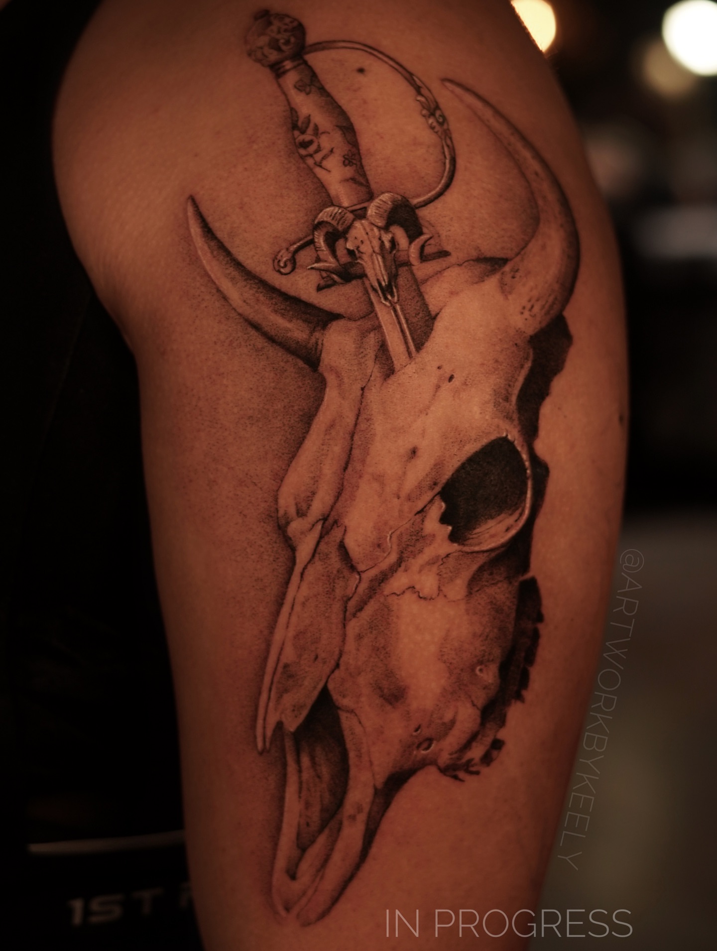 Bull skull with sword realism tattoo on the thigh by Keely Thompson