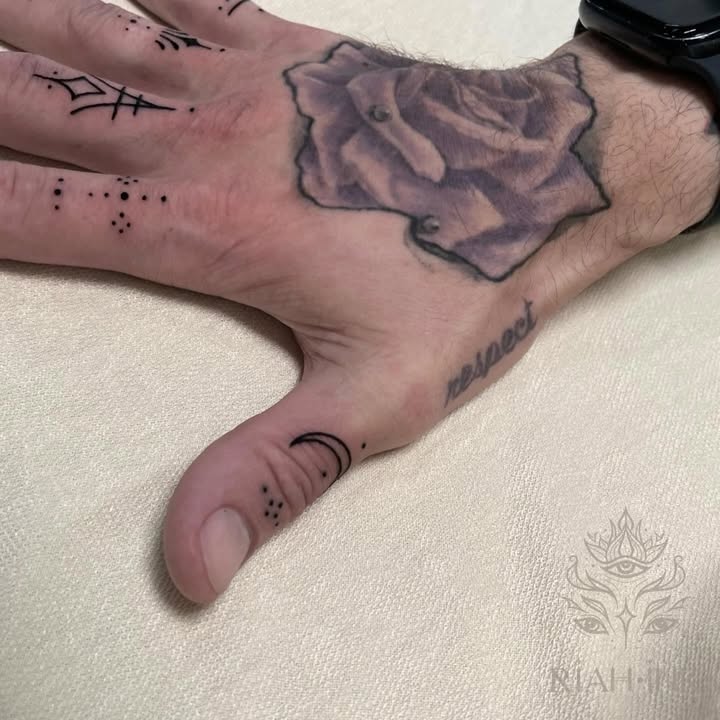 Rose and celestial elements minimalist tattoo on the hand by Nils Bashirian
