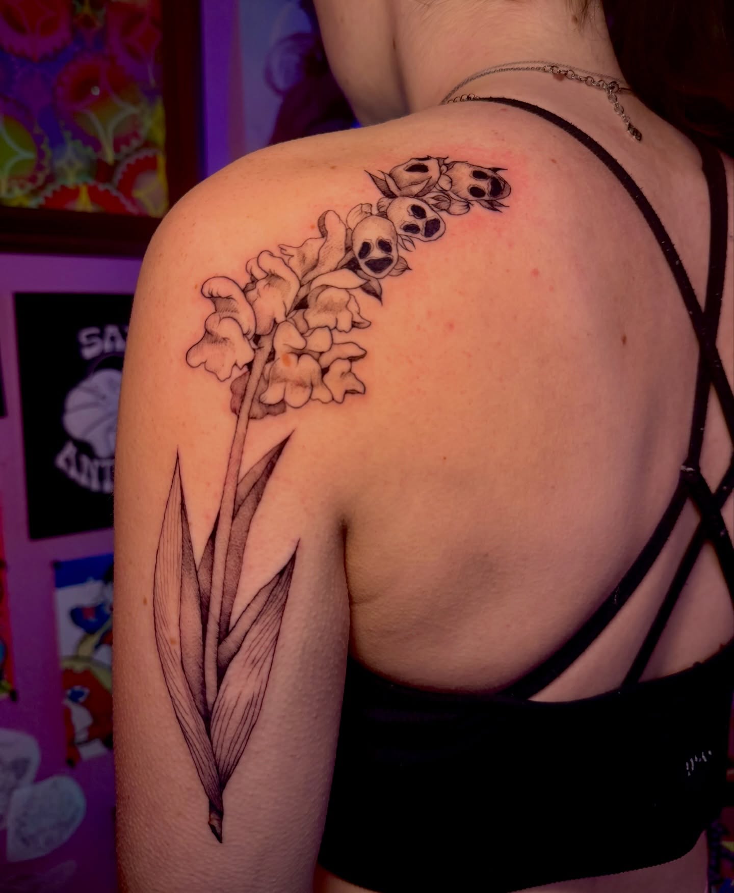 Lily of the valley and skulls black and grey tattoo on the shoulder by ✧Lee Ortiz