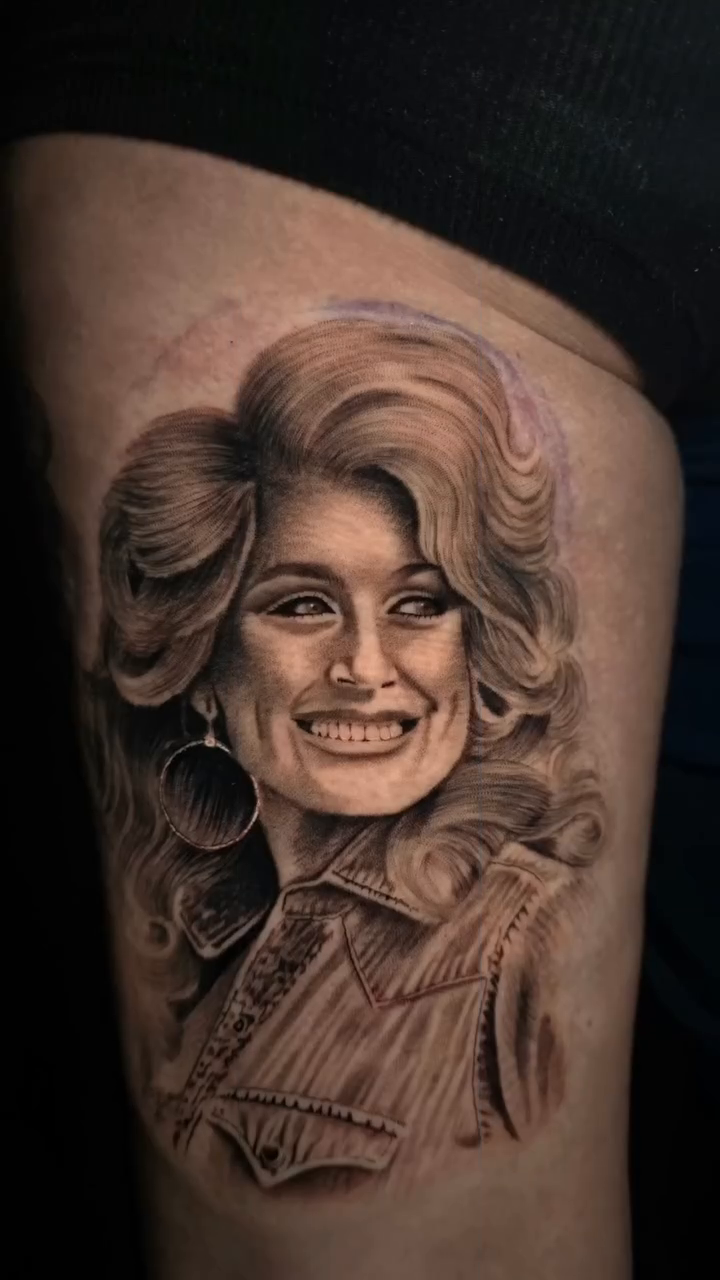Dolly Parton portrait realism tattoo by Anna Brittany