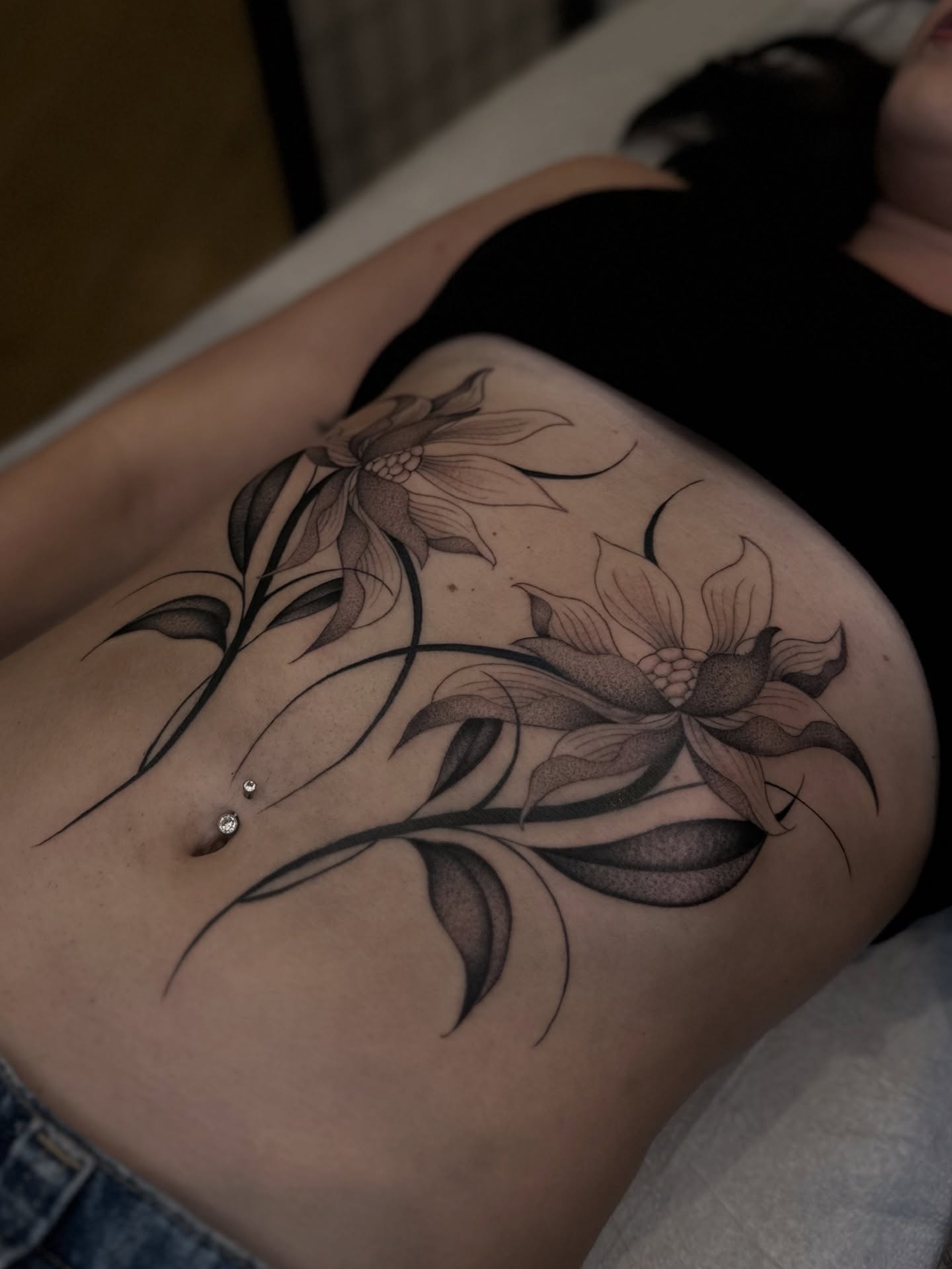 Floral design black and grey tattoo on the thigh by Адріянна Стабс 🇺🇦, New York, New York