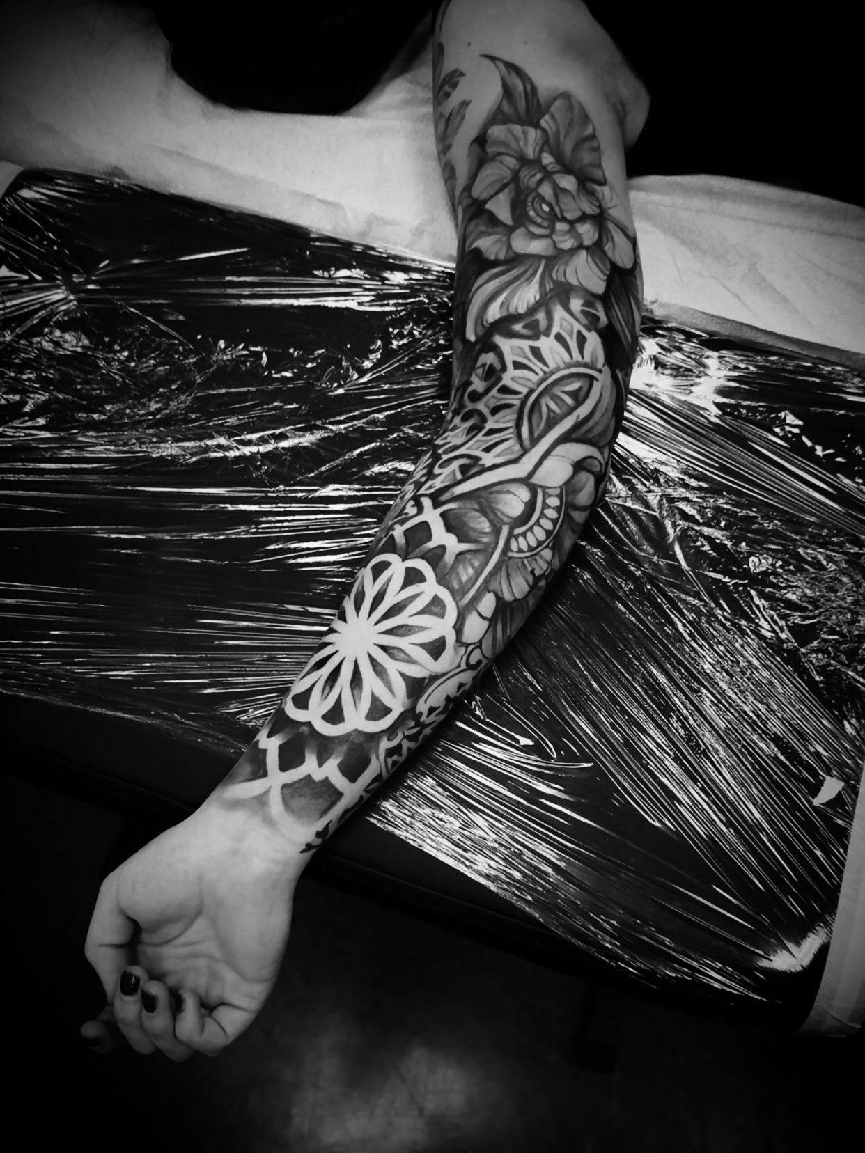 Floral and abstract patterns ornamental tattoo on the forearm by Julian Olson