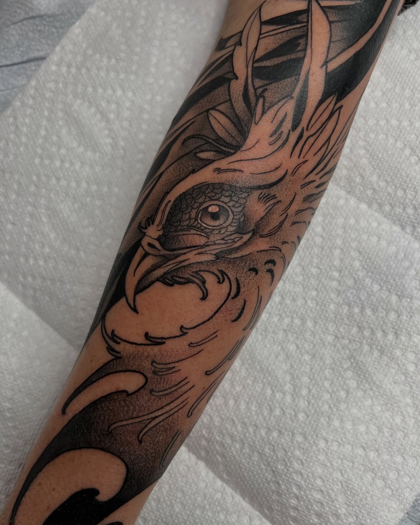 Koi fish dotwork tattoo on the forearm by Nathan Garcia