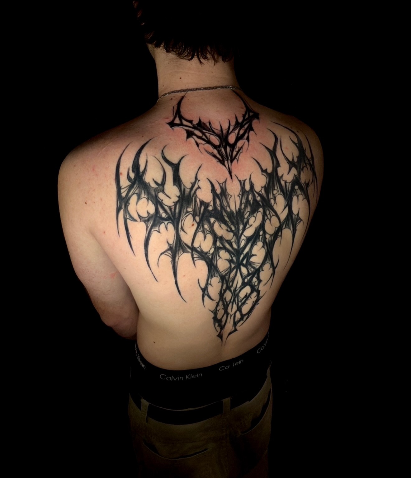 Floral tribal tattoo on the back by Thomas Martinez