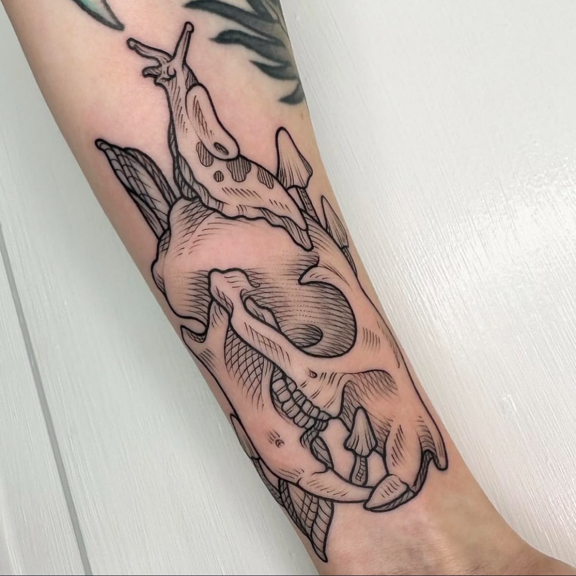 Snail and heart realism tattoo on the forearm by Taylor 🍂☕️