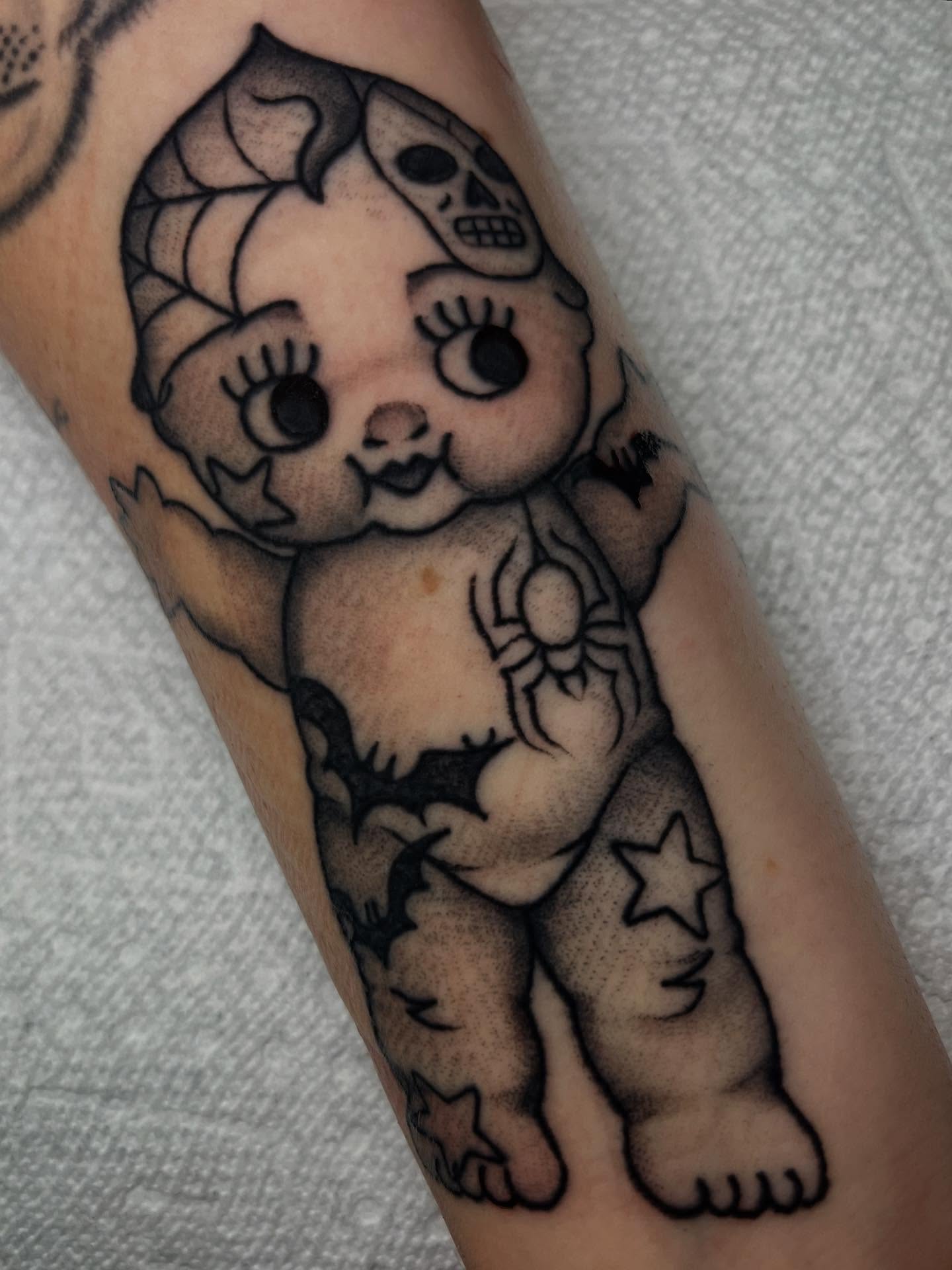 Baby with skull black and grey tattoo on the forearm by ⭐️ Erin Bauer ⭐️
