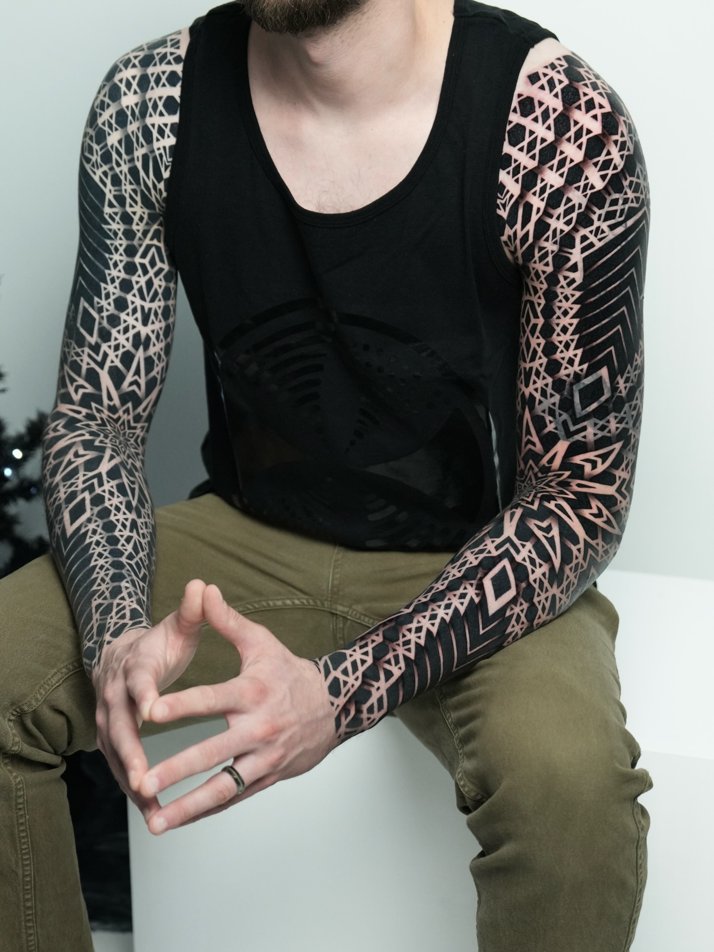 Geometric pattern sleeve geometric tattoo on the upper arm by Ilya Cascad Kandaurov