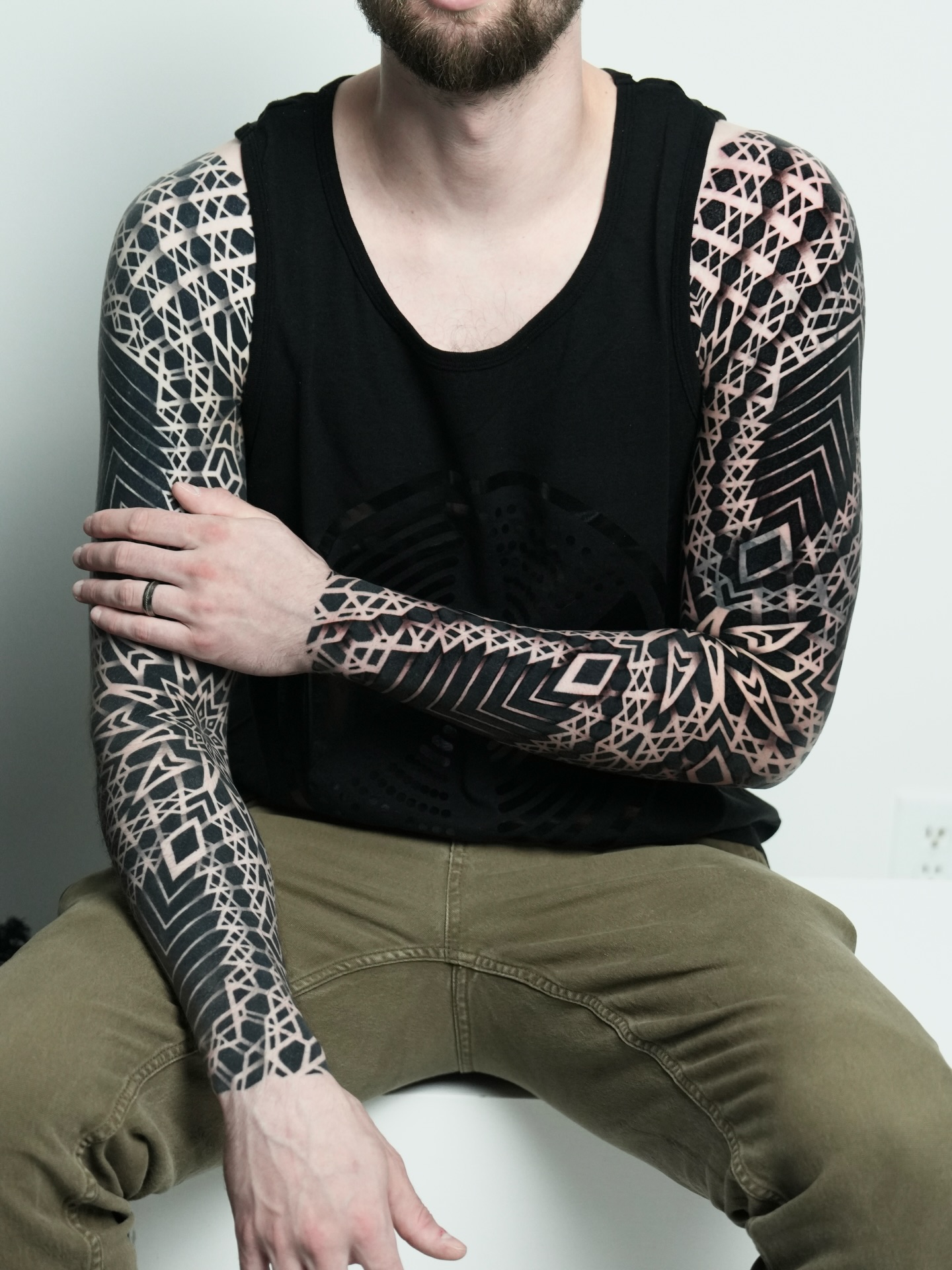 Geometric pattern sleeve geometric tattoo on the upper arm by Ilya Cascad Kandaurov