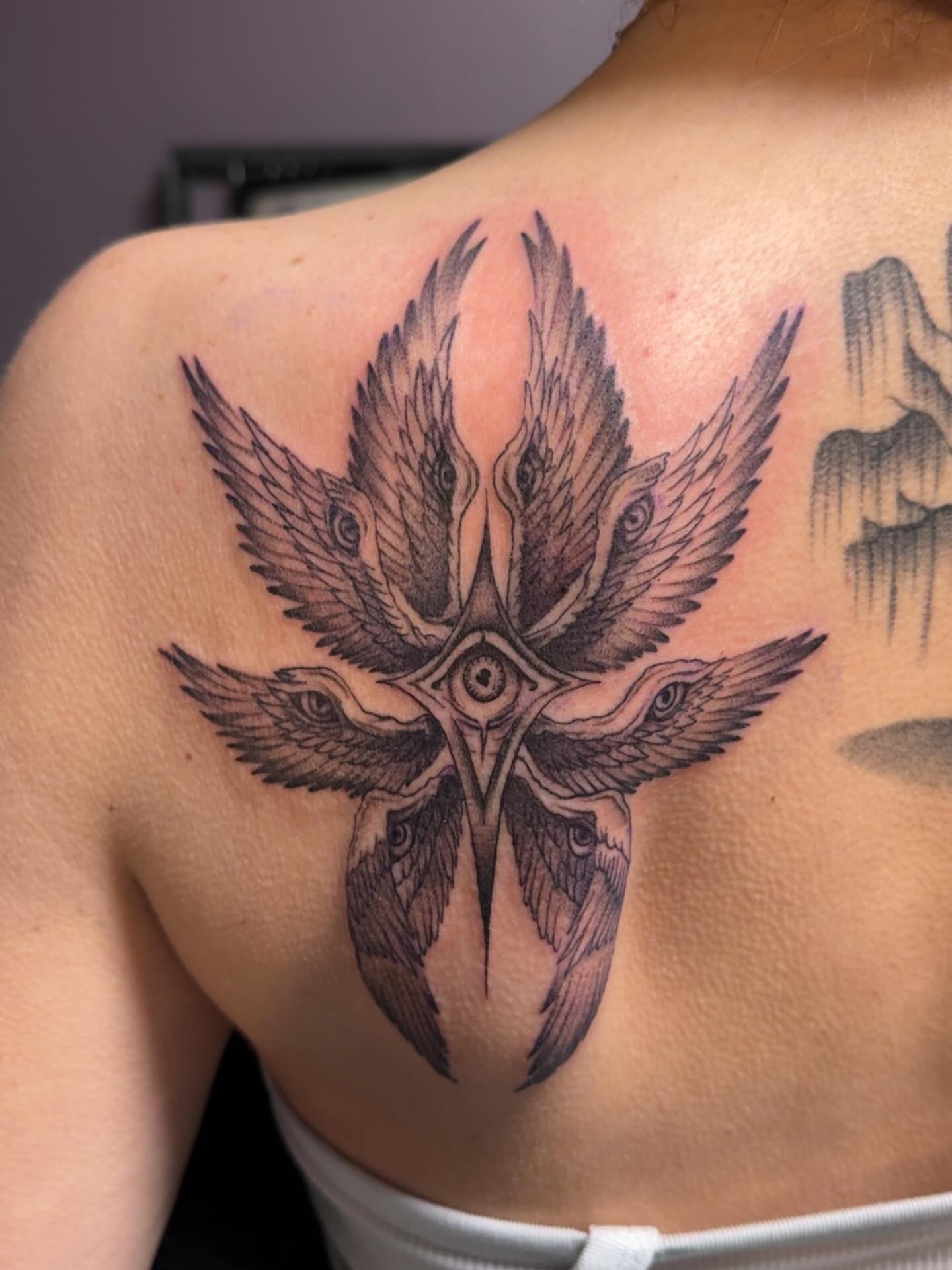 Bird geometric tattoo on the shoulder by Lindsay
