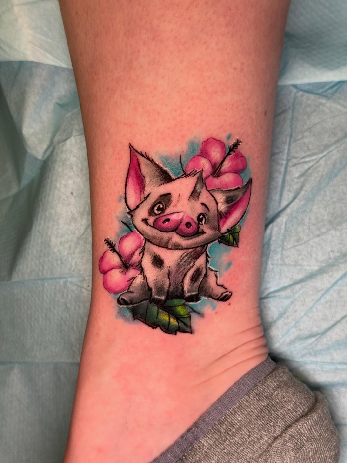Pig with flowers watercolor tattoo on the forearm by Vega
