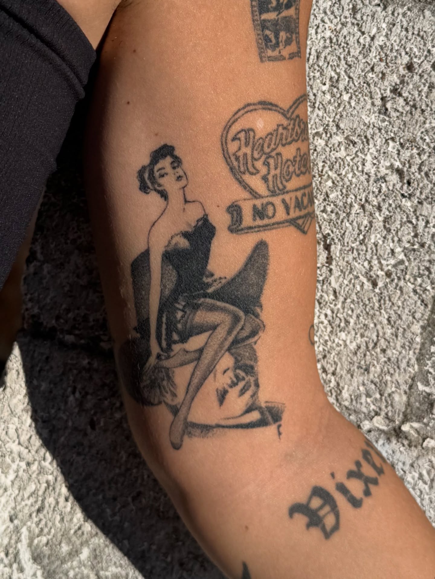 Pin-up girl American traditional tattoo on the forearm by Zanereti