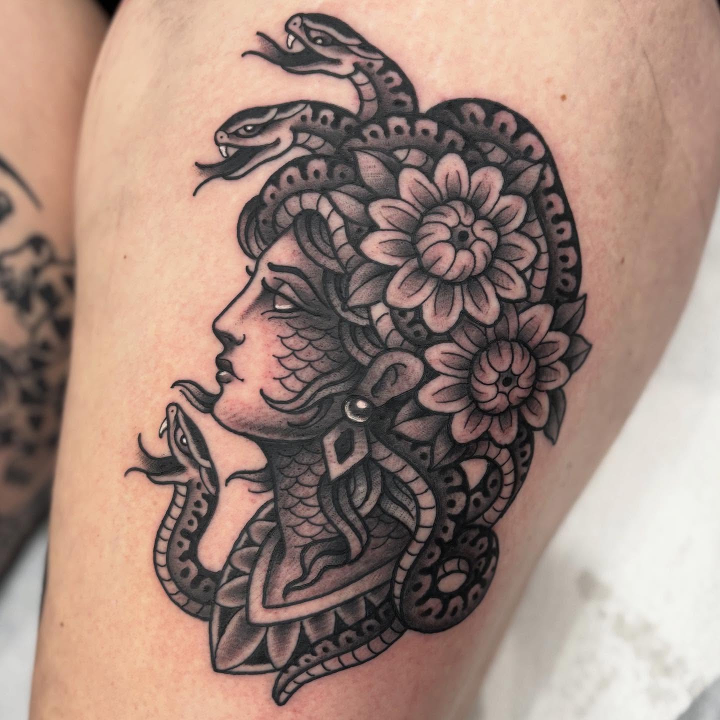 Medusa American traditional tattoo on the thigh by Cody Collins