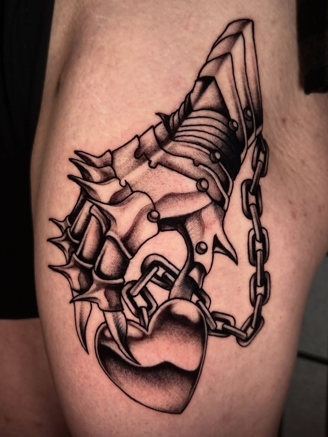 Spiked gauntlet holding heart realism tattoo on the thigh by ๐ฅ๐๐ท๐ข๐ฉ