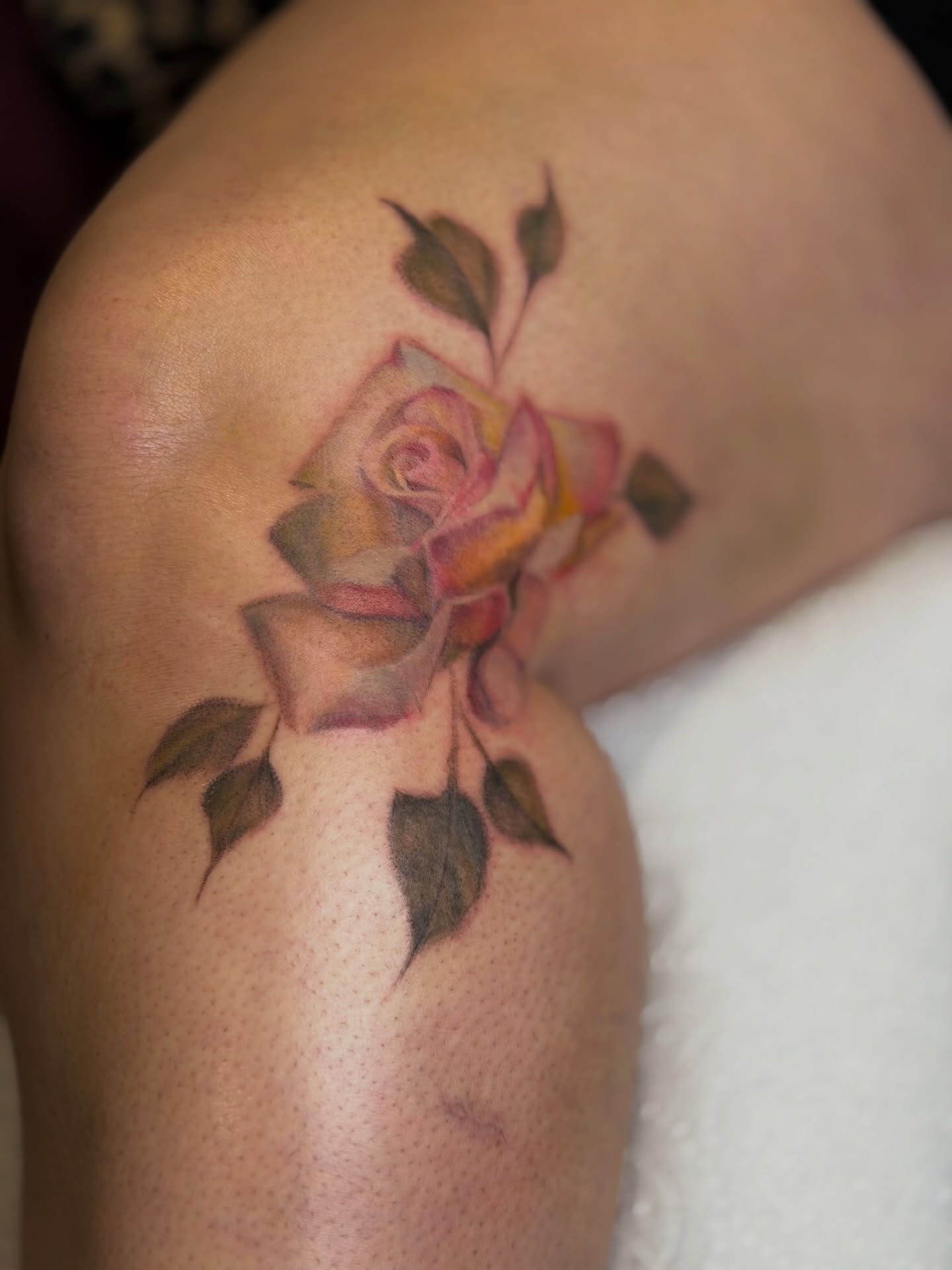 Rose realism tattoo on the shoulder by Mackenzie