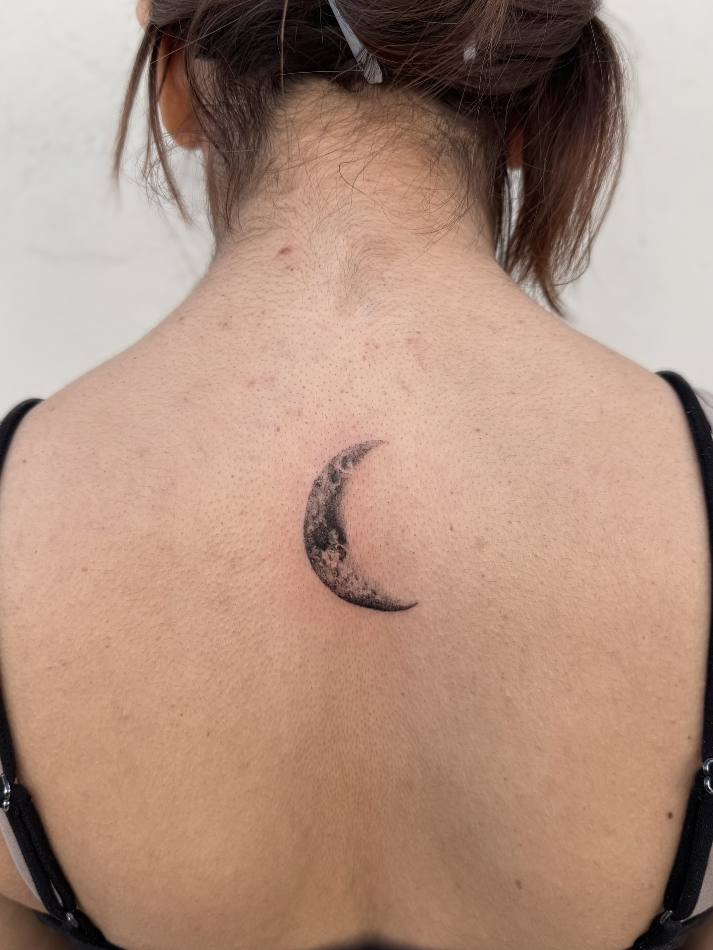 Half moon black and grey tattoo on the back by Raleigh tattoo artist, Raleigh, North Carolina