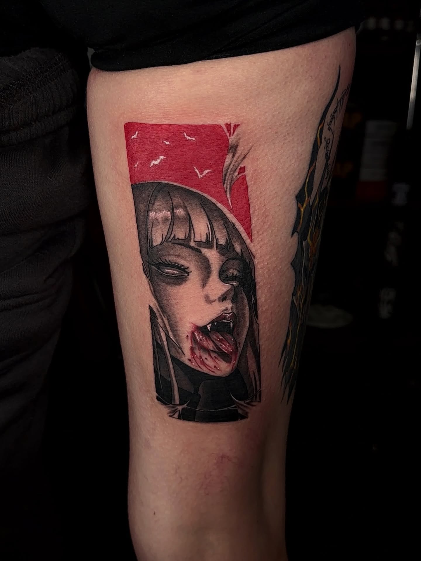 Woman with vampire fangs dark realism tattoo on the forearm by Denis Seregin