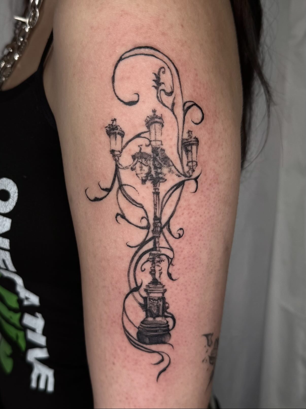 Candelabra black and grey tattoo on the forearm by Isabella π€