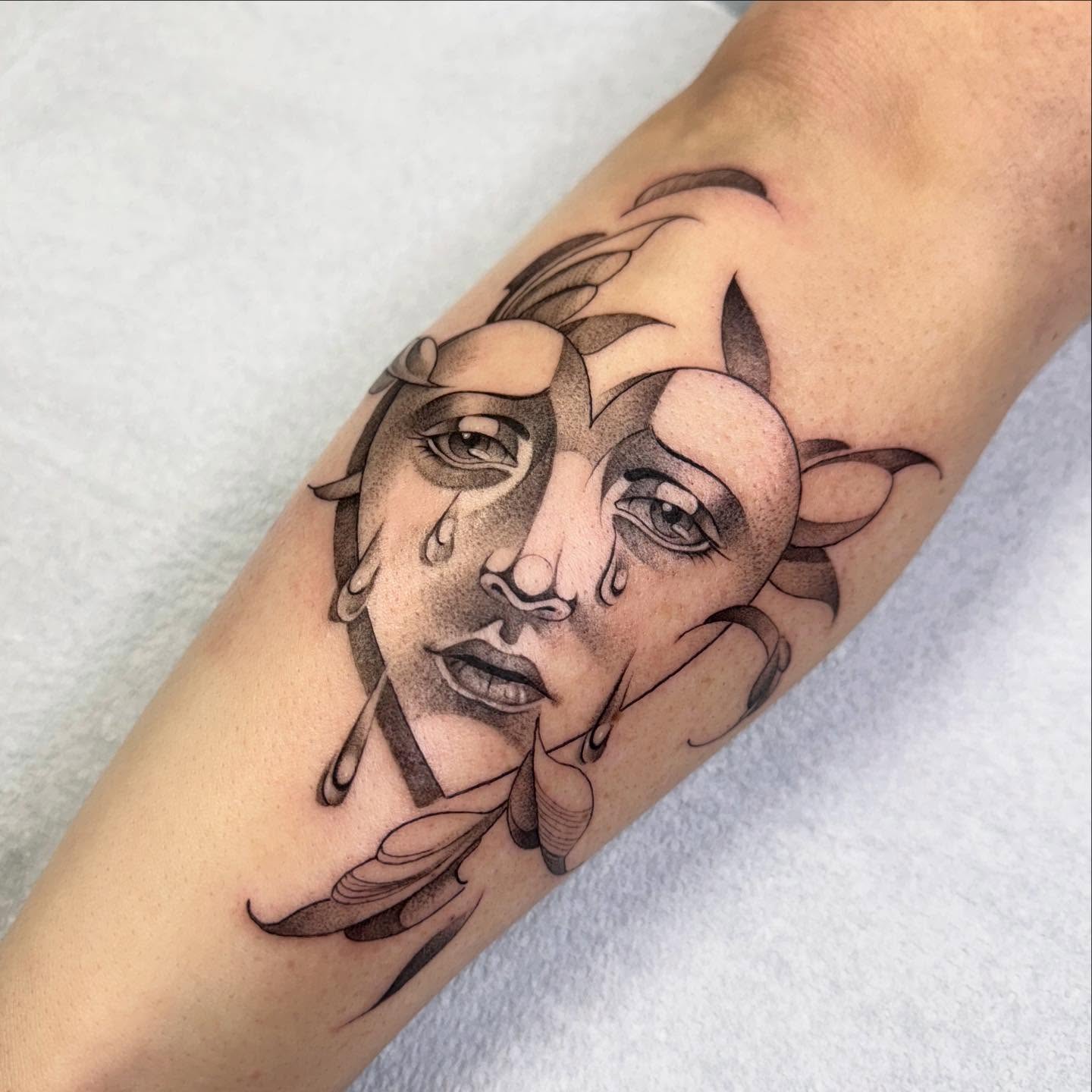 Abstract face dotwork tattoo on the forearm by Alyssa . Villela