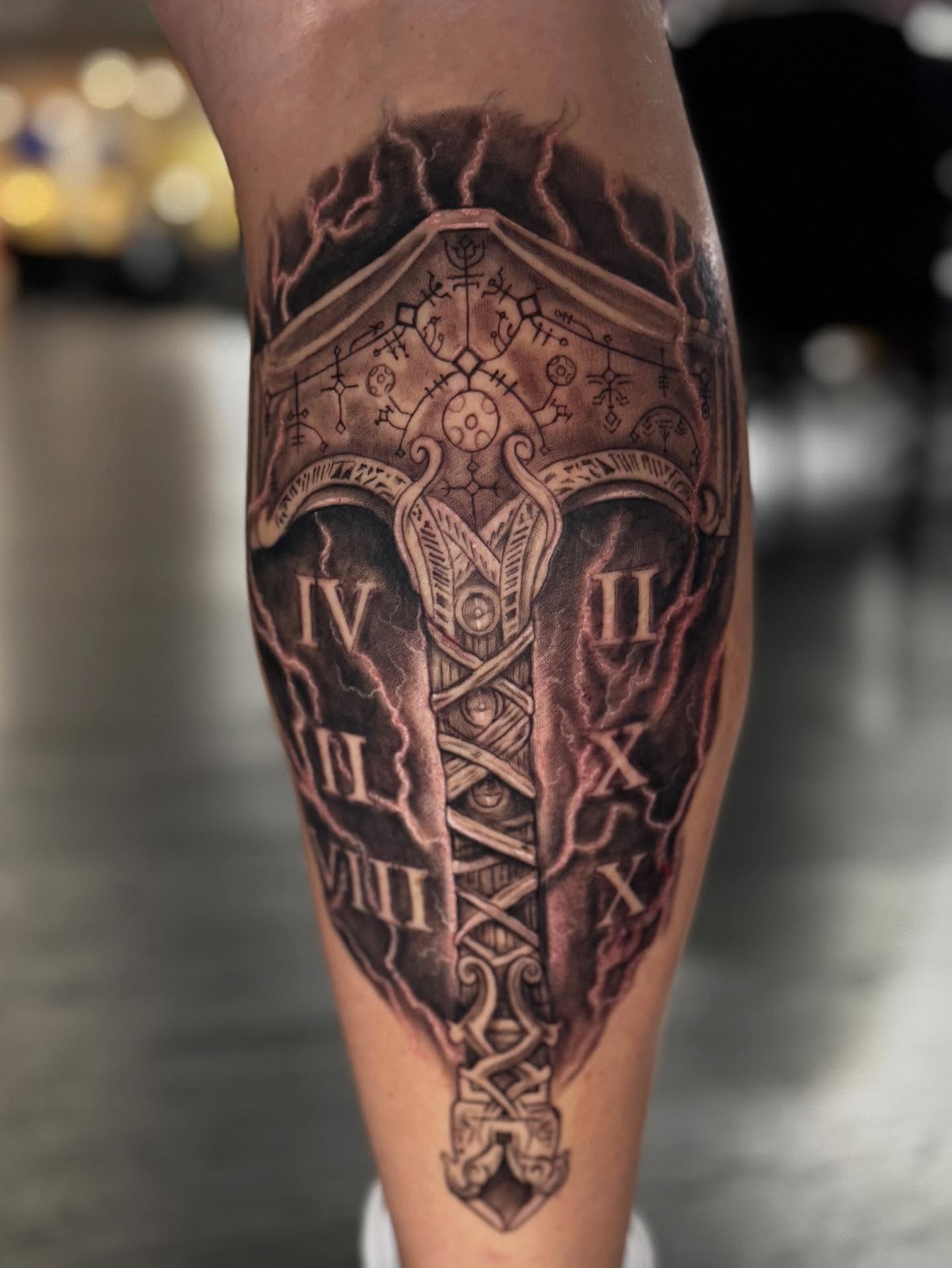 Ancient shield realism tattoo on the forearm by Shawn Skale