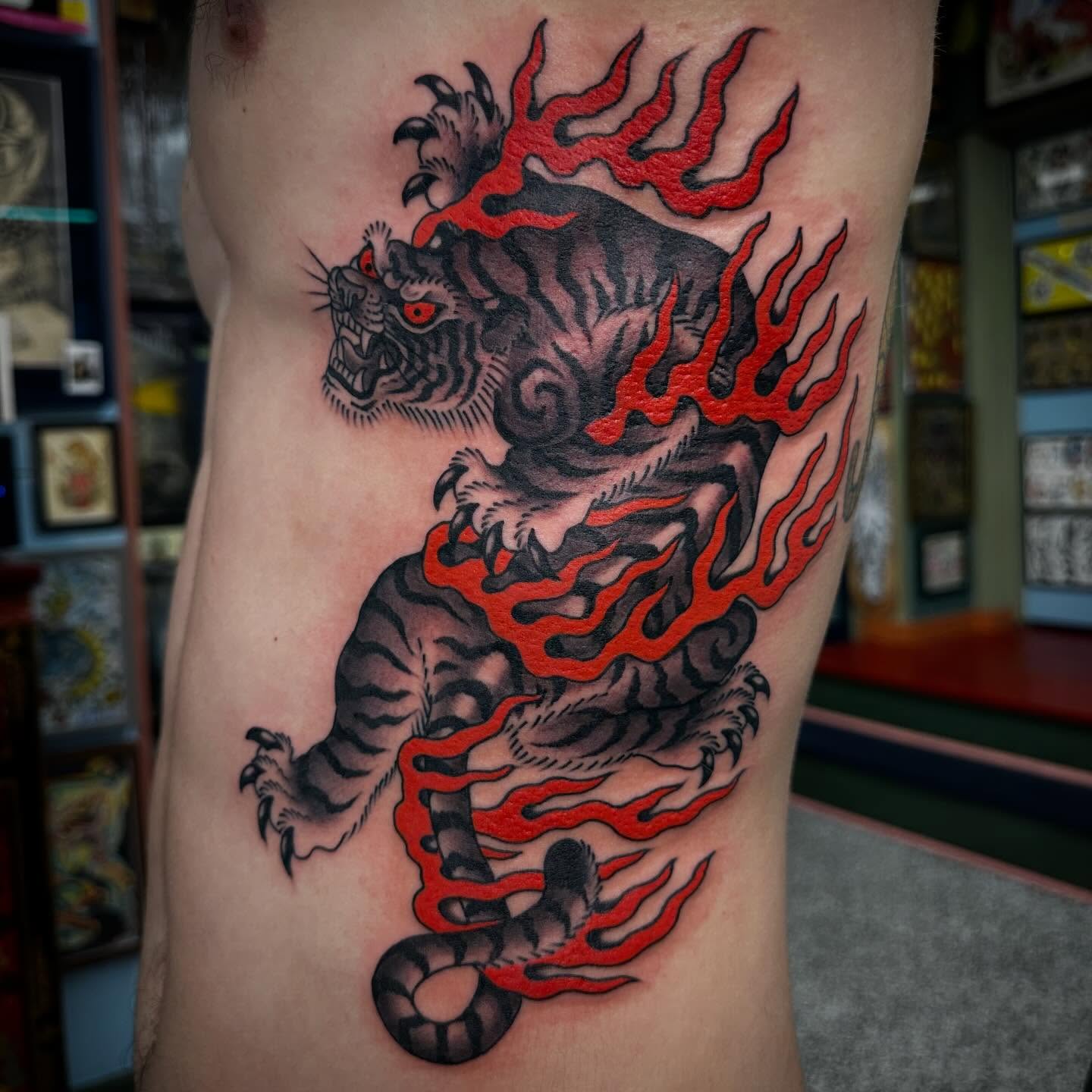 Tiger with flames japanese irezumi tattoo on the ribs by Nathan Rohrbacher, Nashville, Tennessee