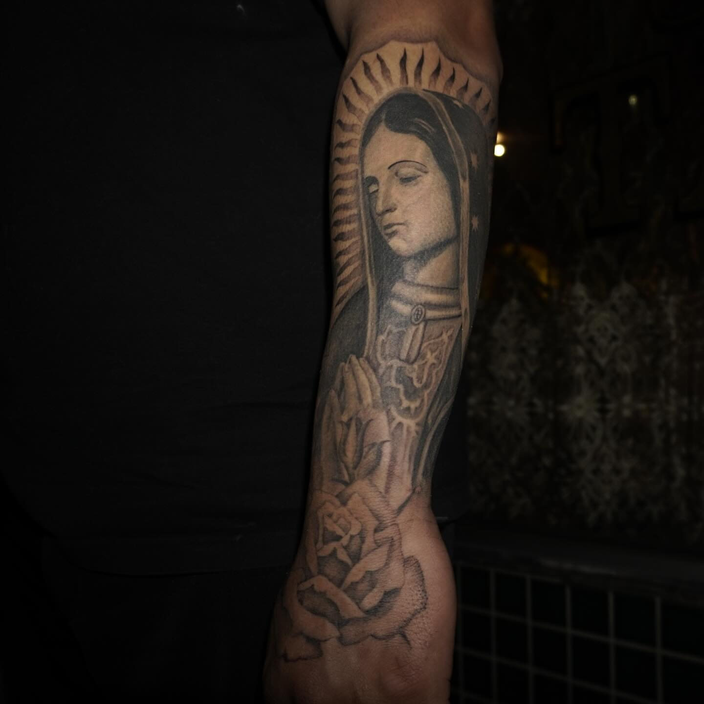 Religious figure black and grey tattoo on the forearm by San Diego tattoo artist