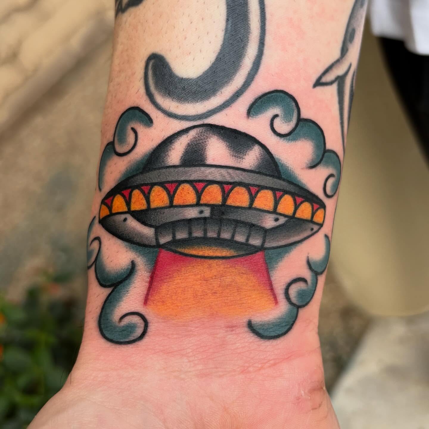 UFO American traditional tattoo on the forearm by Allyson Monique