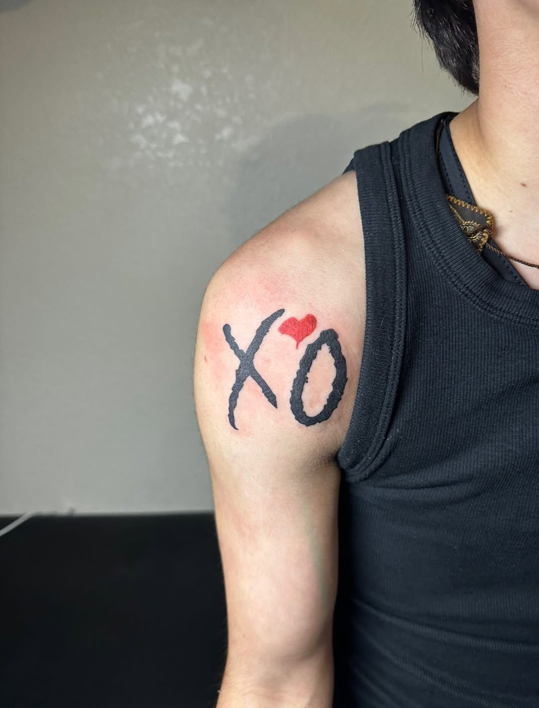 XO with heart cyber sigilism tattoo on the shoulder by Lupita Ink