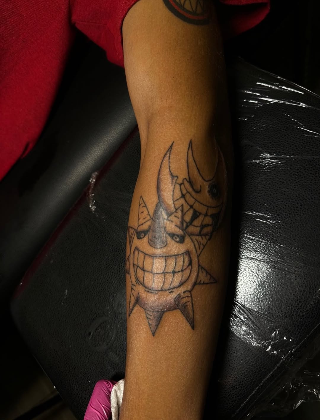Sun and Moon characters new school tattoo on the forearm by Lupita Ink
