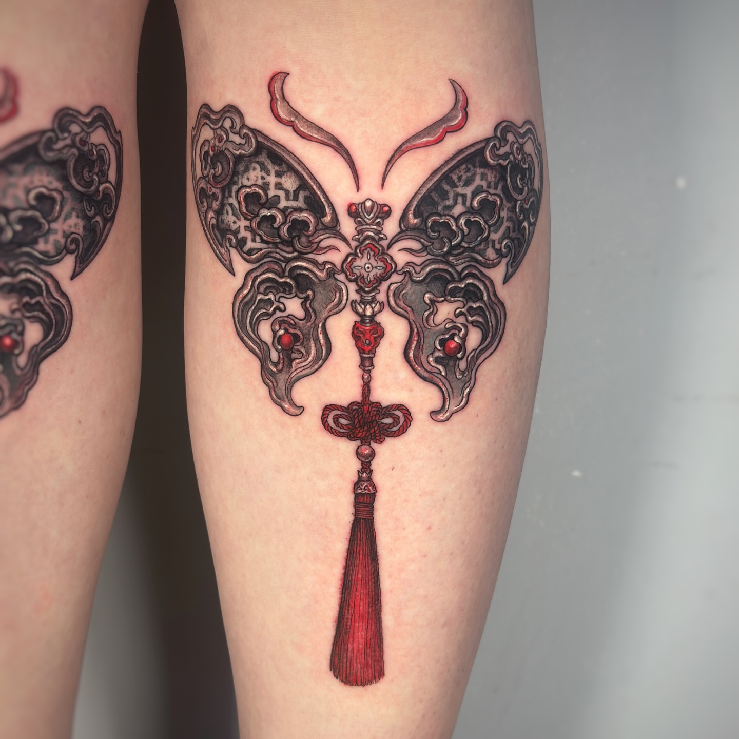 Butterfly ornamental tattoo on the leg by Jemin Ren