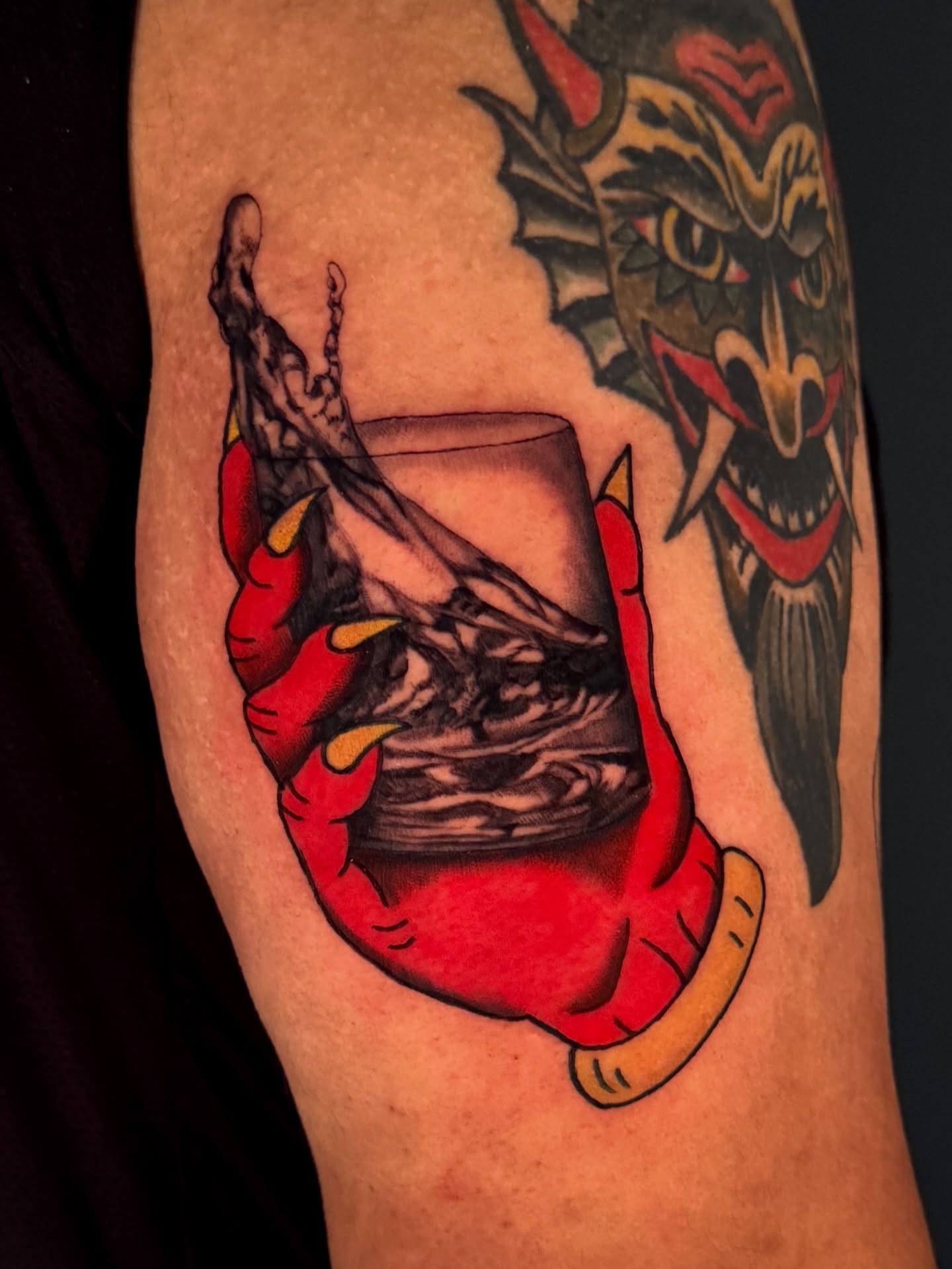Demon hand holding glass American traditional tattoo on the forearm by Dallas Tattoo Artist