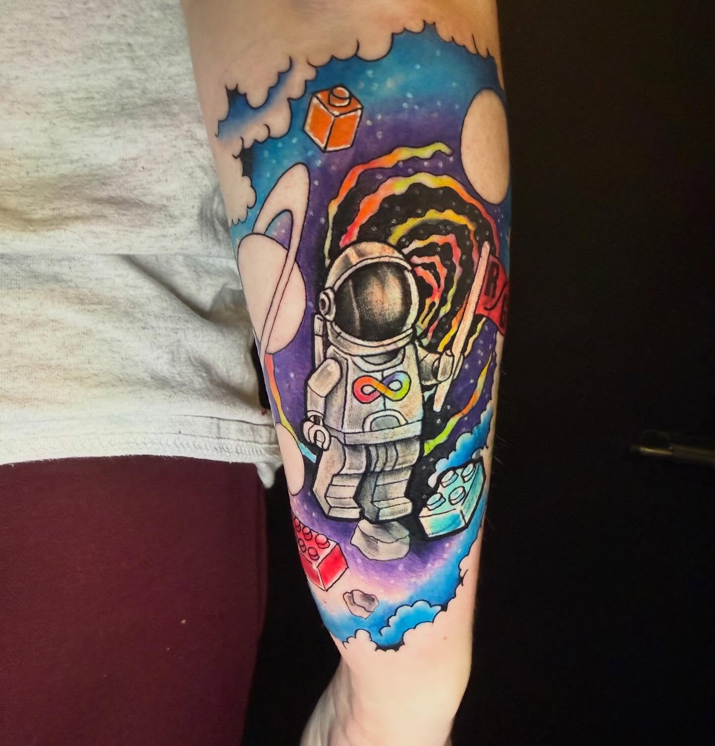 Astronaut in space new school tattoo on the forearm by Paul Calhoun Tattoos, Englewood, Ohio