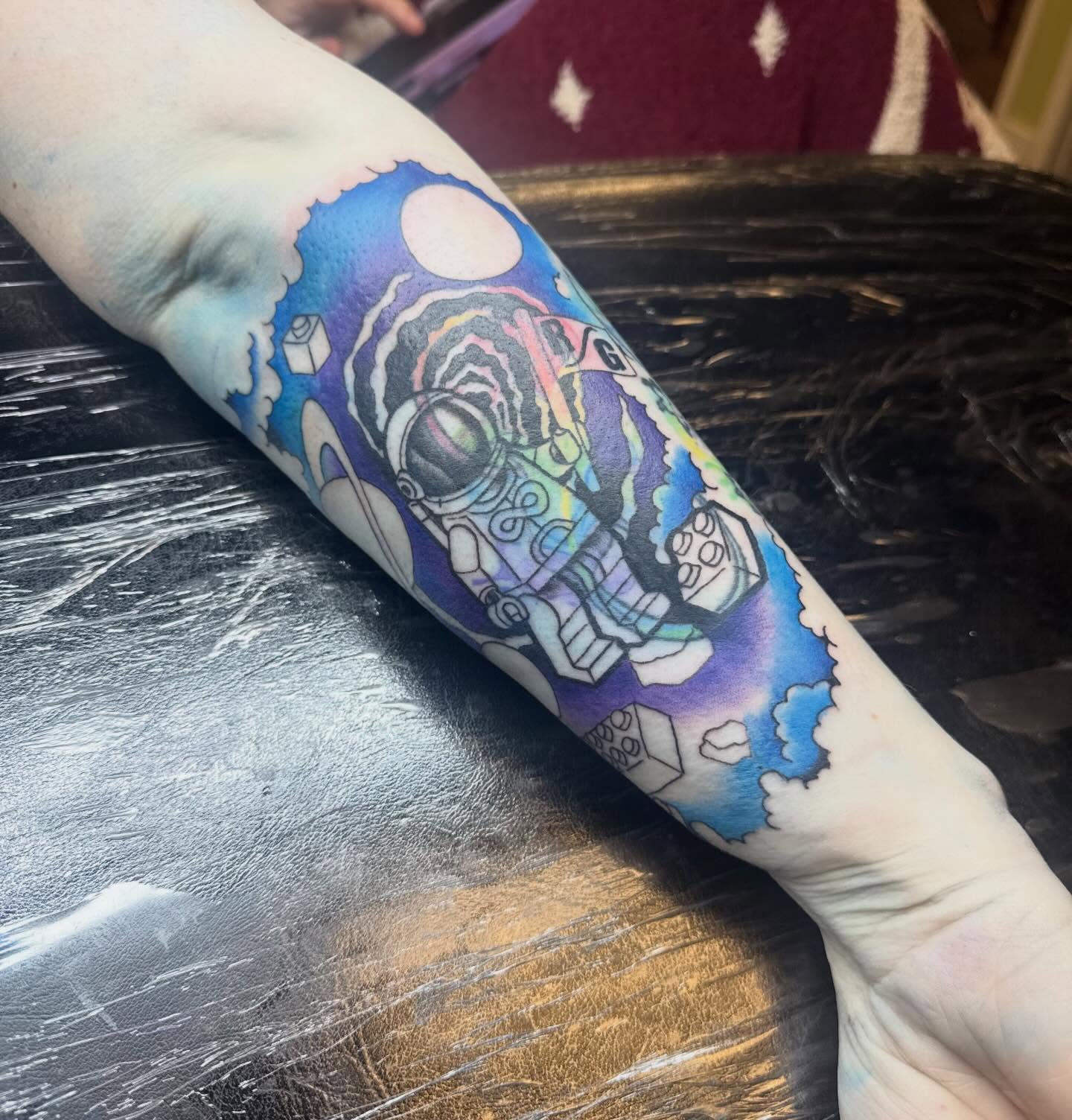 Astronaut new school tattoo on the forearm by Paul Calhoun Tattoos, Englewood, Ohio
