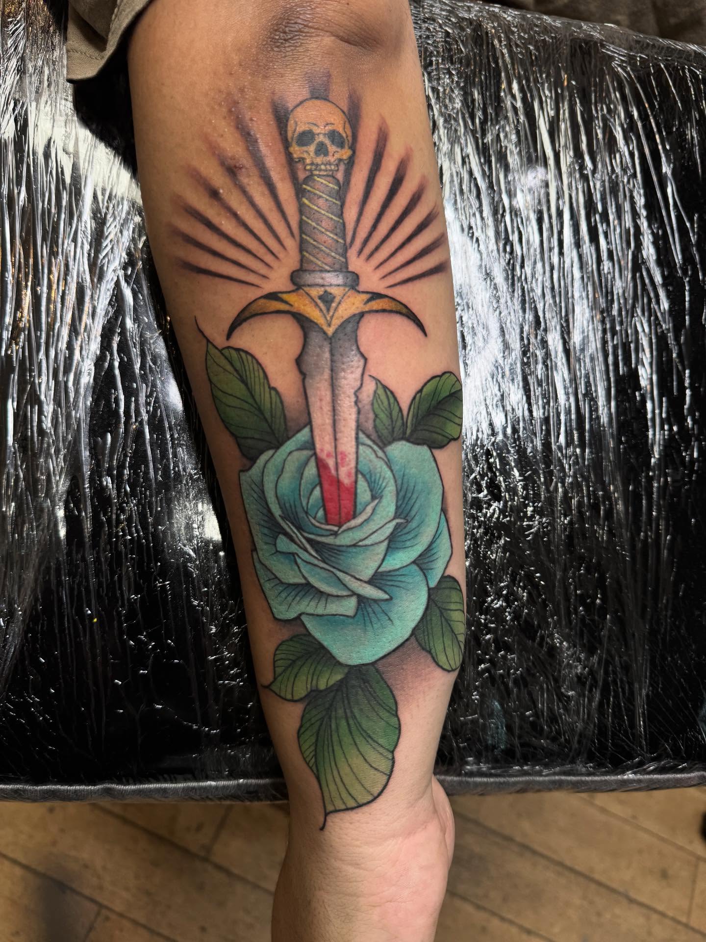 Sword through rose American traditional tattoo on the forearm by Ashley Hsiung *Panda*
