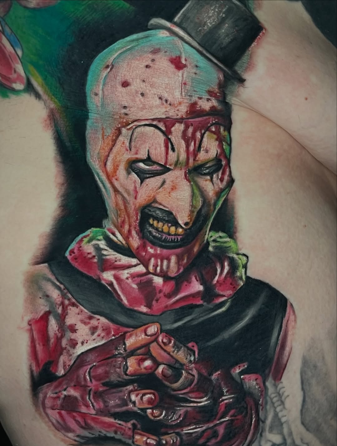 Art the Clown realism tattoo on the chest by Rich Bustamante