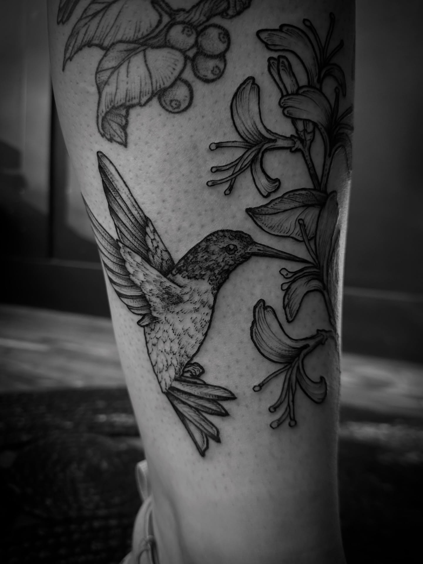 Hummingbird and flowers realism tattoo on the forearm by Desireé Keys, Midvale, Utah
