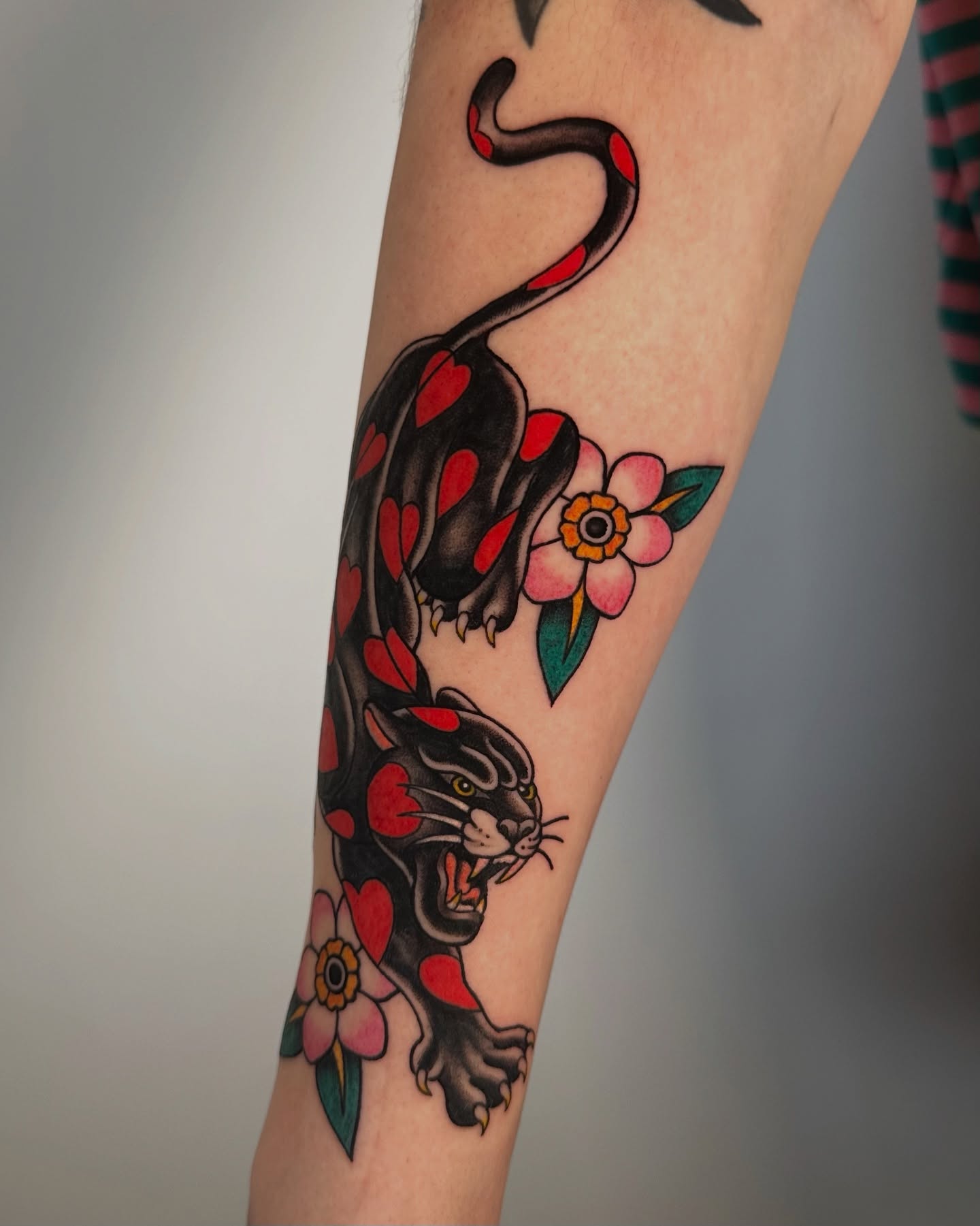Panther and flowers American traditional tattoo on the forearm by Ash Gonzalez ❤️ Austin Tattoo Artist