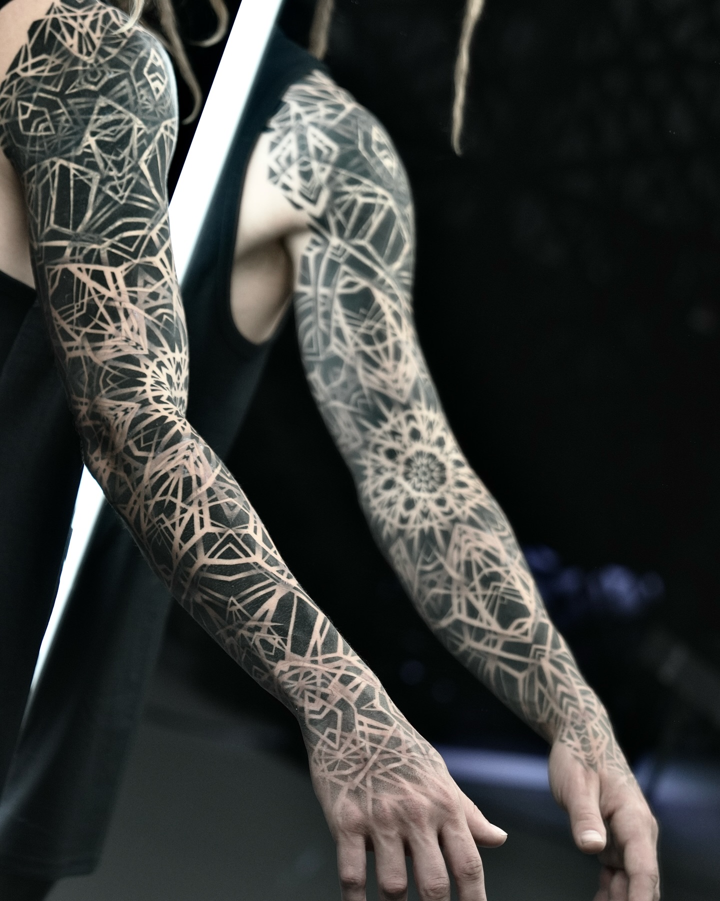 Geometric pattern sleeve geometric tattoo on the upper arm by Ilya Cascad Kandaurov