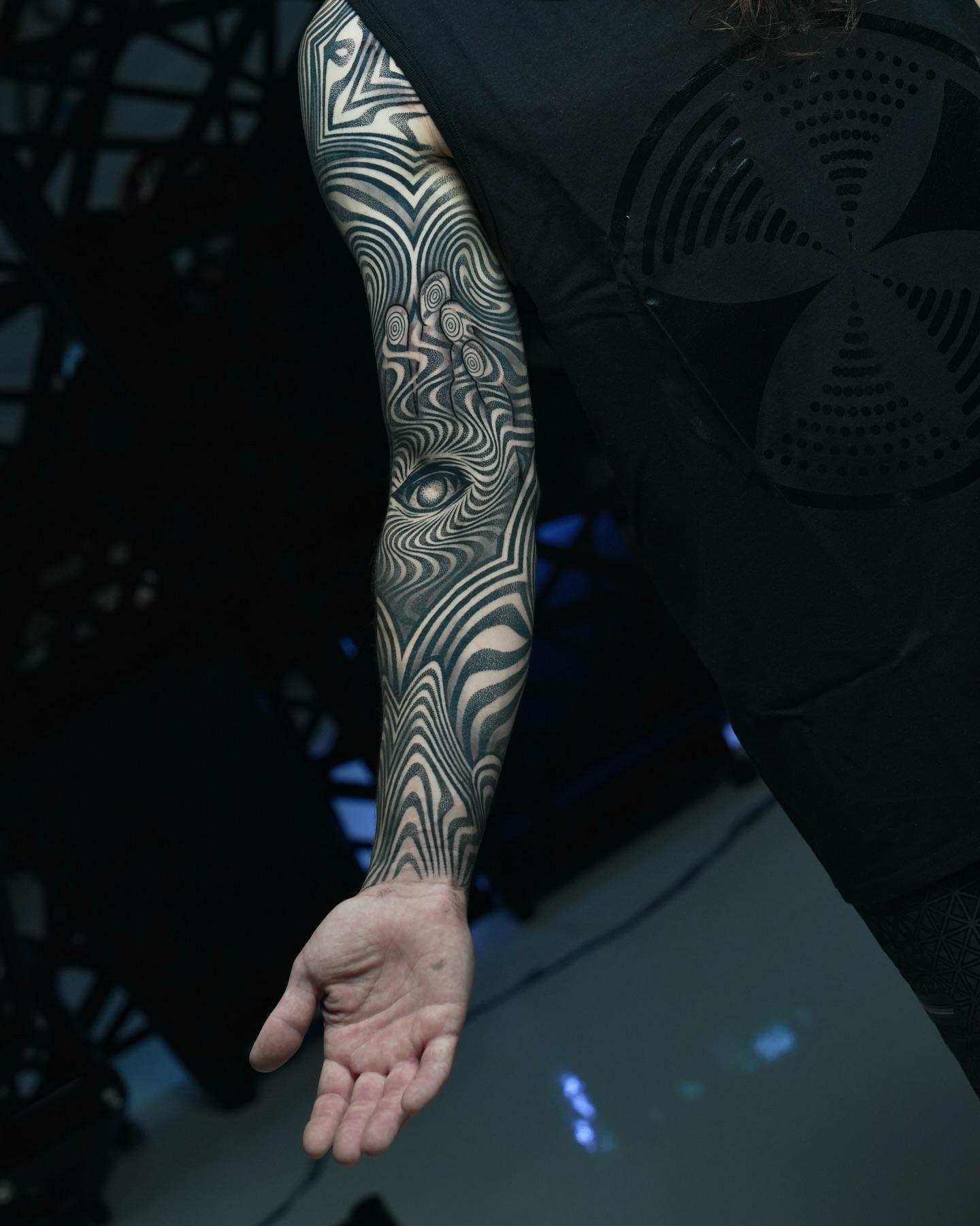 Abstract optical illusion eye geometric tattoo on the forearm by Ilya Cascad Kandaurov