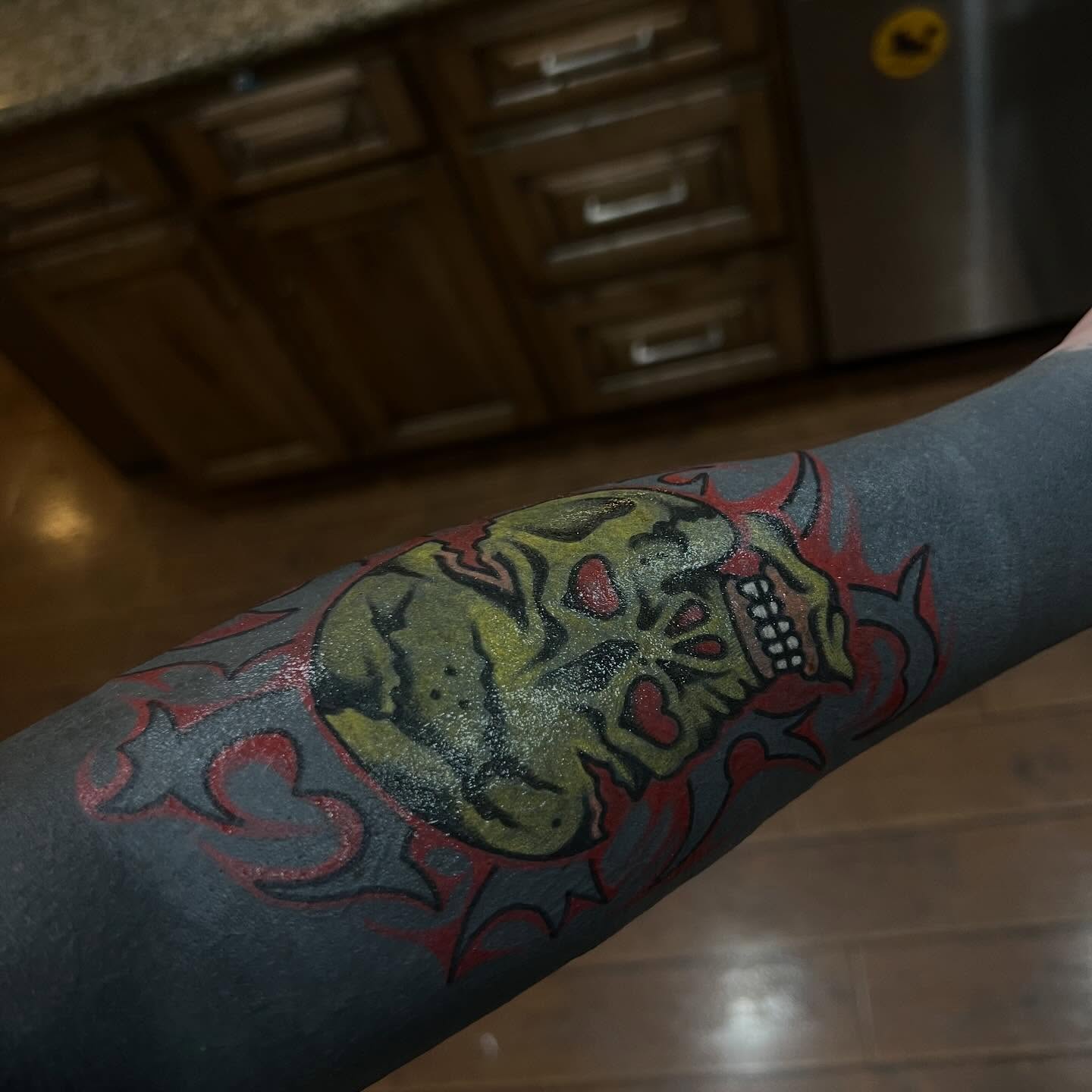 Skull American traditional tattoo on the forearm by Benjamin Ward