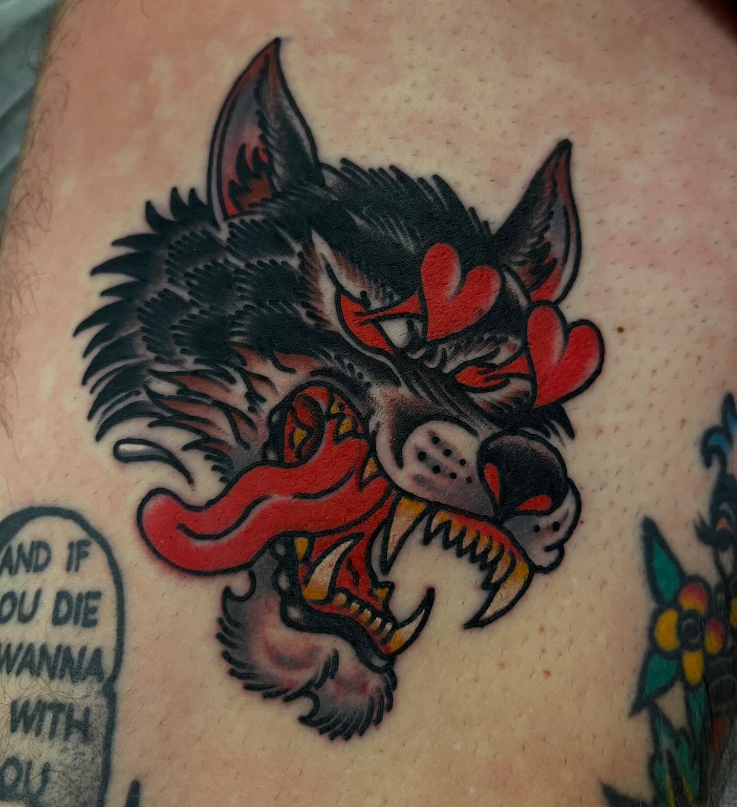 Wolf head American traditional tattoo on the thigh by Lee Brewster, Erlanger, Kentucky