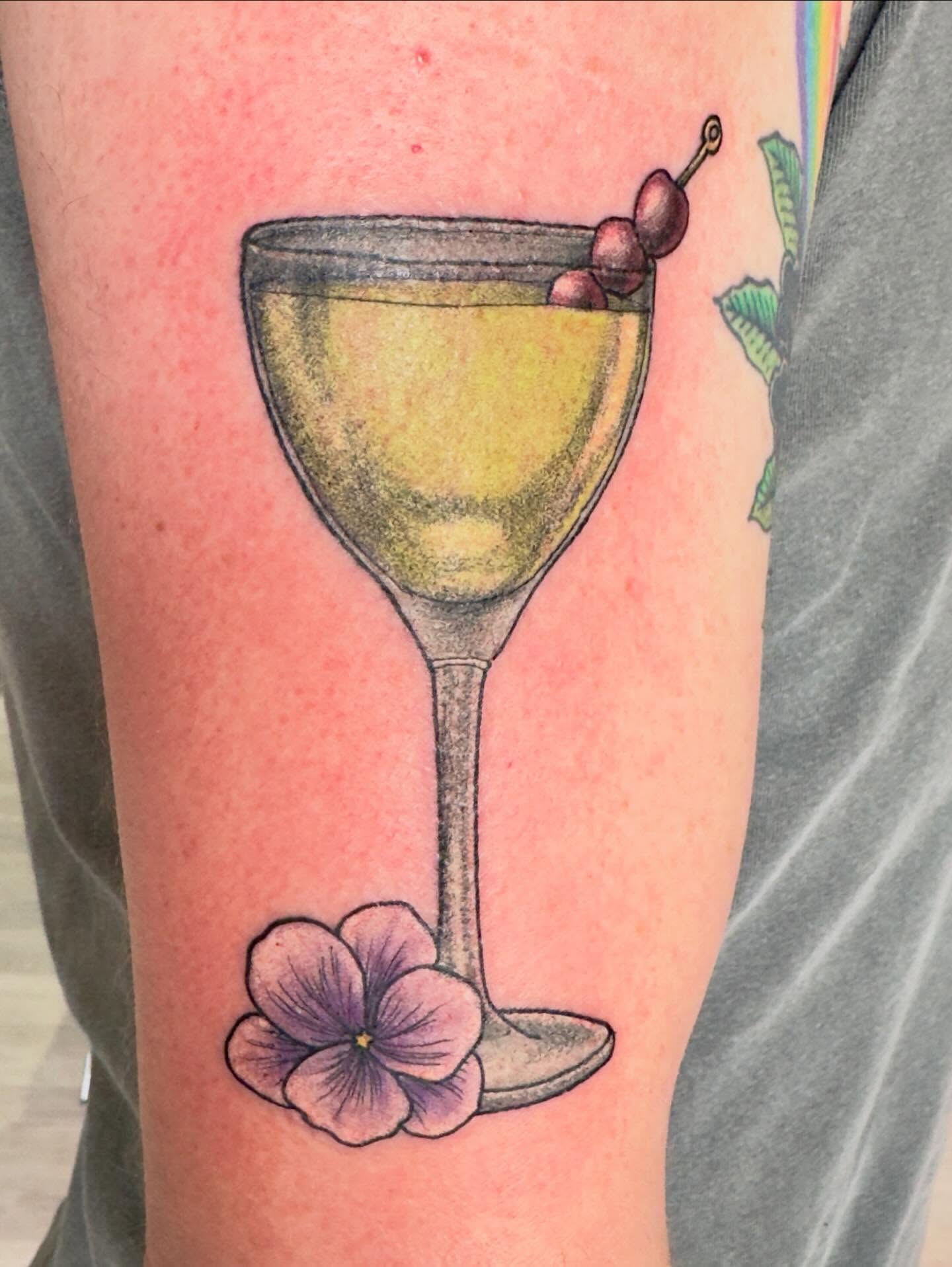 Martini glass with cherries realism tattoo on the forearm by Patrick Carroll