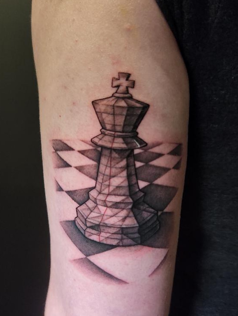 King chess piece geometric tattoo on the forearm by Zachary Hayden
