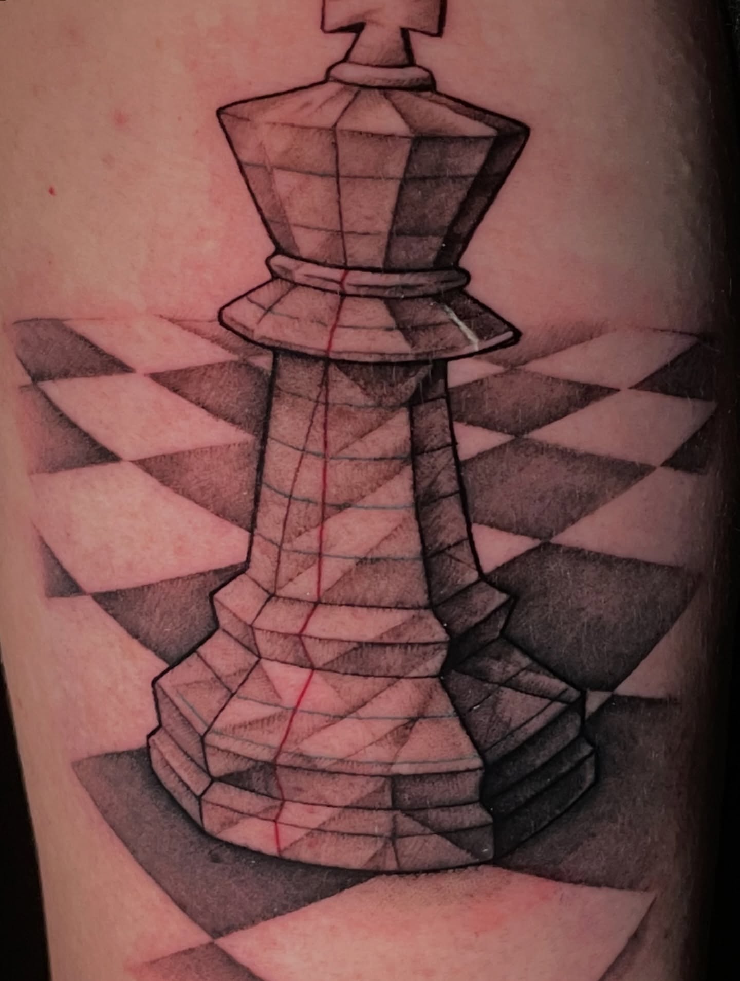 Chess king geometric tattoo on the forearm by Zachary Hayden