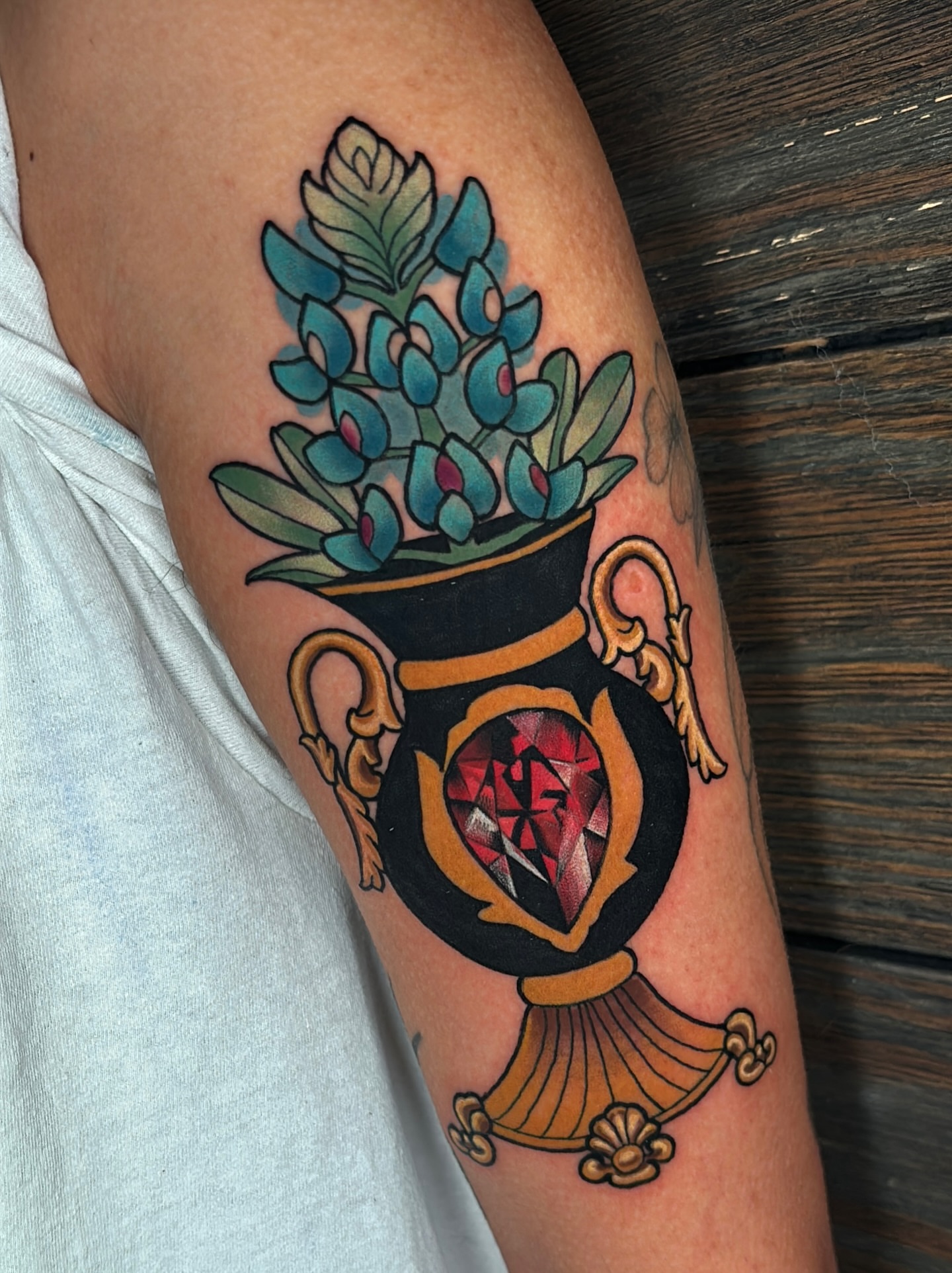 Bluebonnet bouquet American traditional tattoo on the forearm by Latesha Burnley