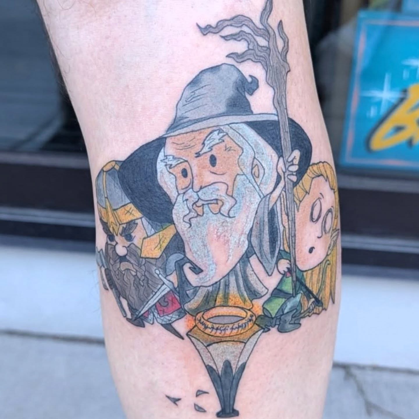 Wizard and hobbits realism tattoo on the forearm by Nico Capriotti ๐ณ๏ธโ๐