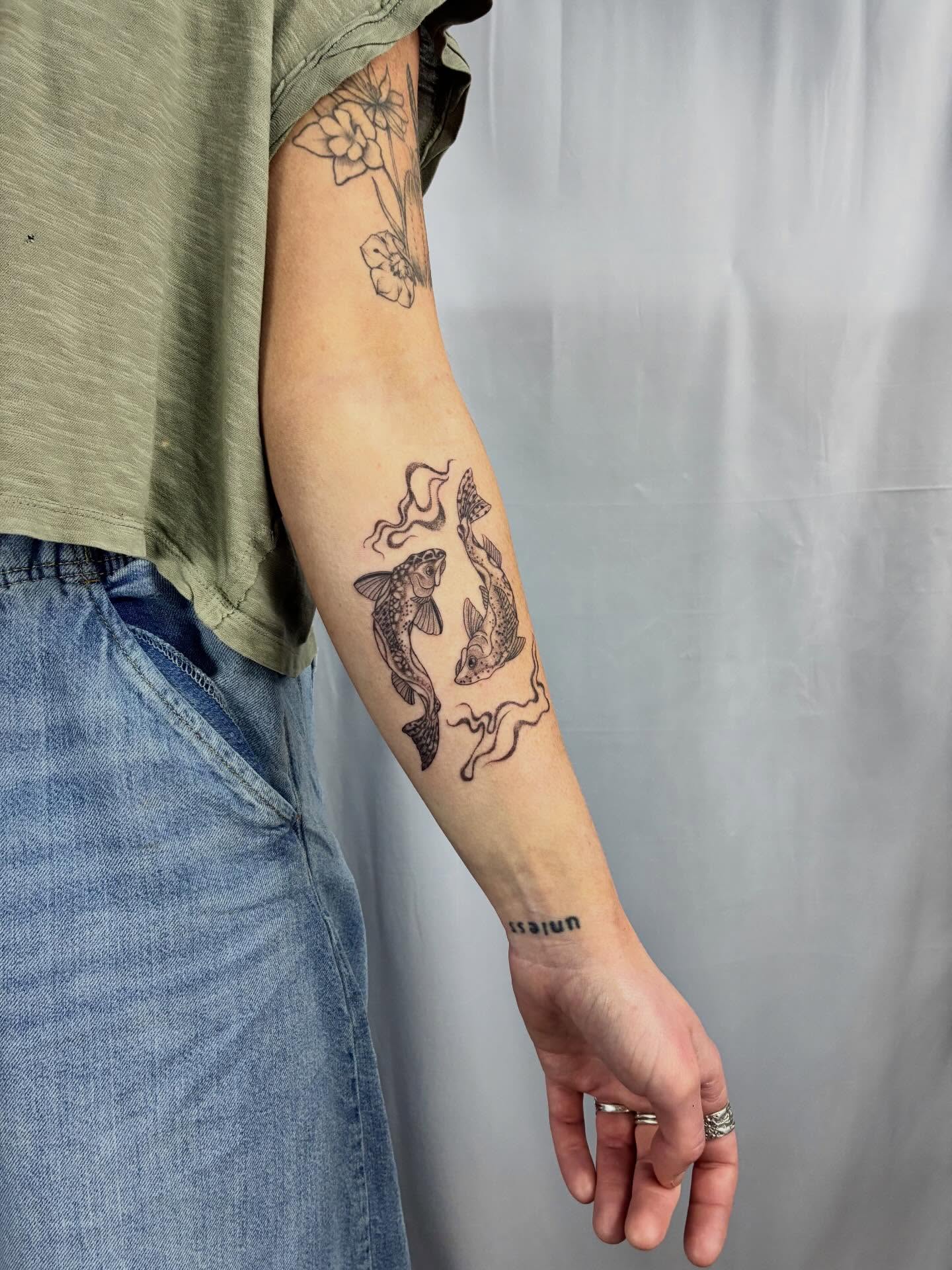 Fishes black and grey tattoo on the forearm by ⊹ Avery Peterson ⊹