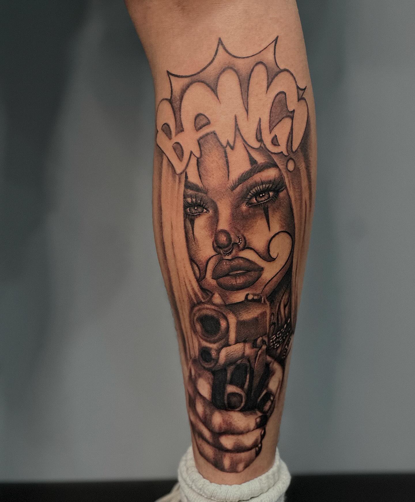 Woman with gun realism tattoo on the forearm by Lissy Red