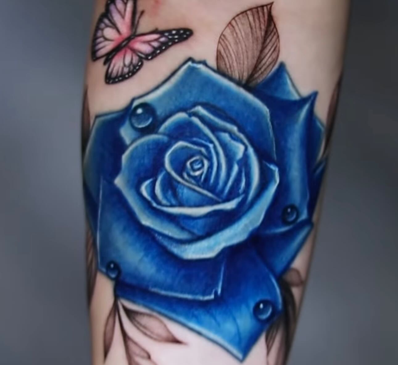 Blue rose realism tattoo on the forearm by 𝐒𝐡𝐞𝐫𝐥𝐥𝐲