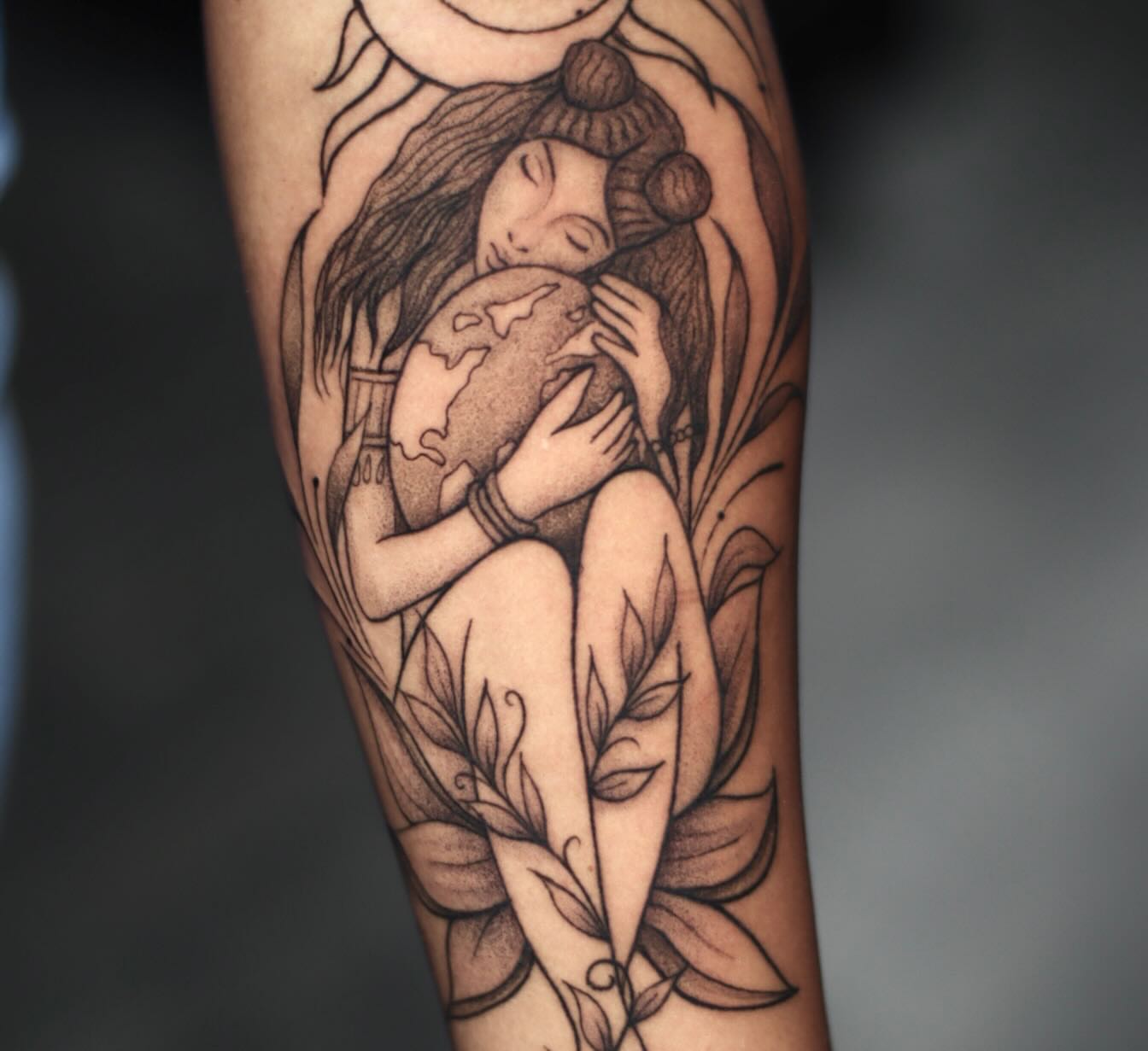 Woman holding globe realism tattoo on the forearm by 𝐒𝐡𝐞𝐫𝐥𝐥𝐲